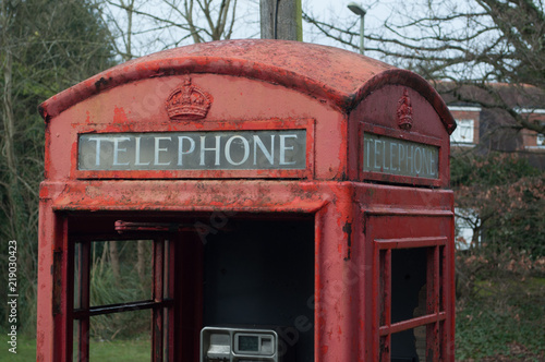 Disused retro red phone box telephone sign