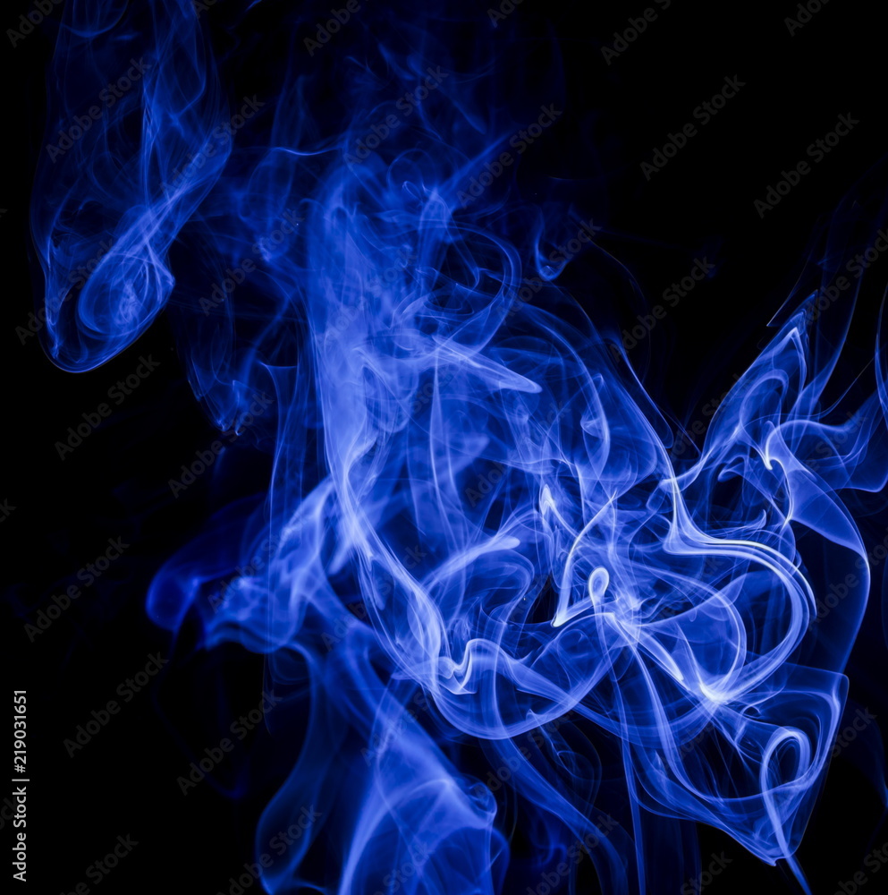 Blue smoke on black background