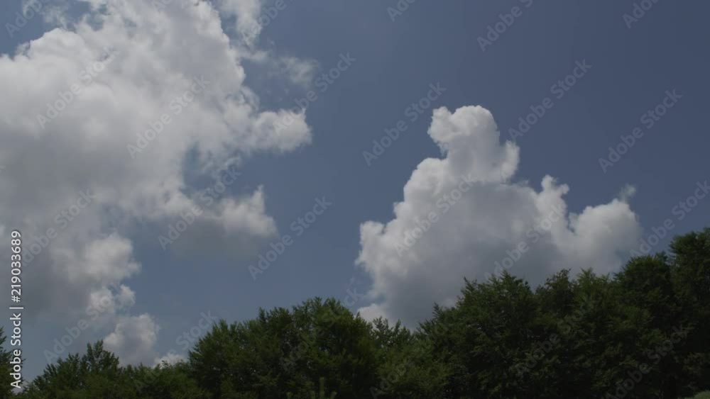 Clouds moving over a green mountain slopes Clouds moving over a green mountain slopes