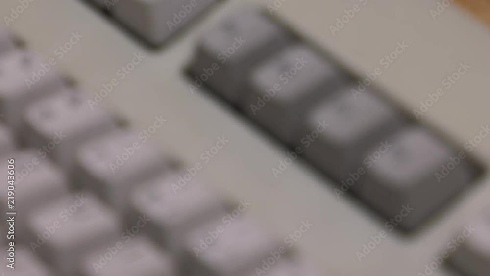 White computer keyboard. Computer or game console from the 90s. Old retro style. , Panning, closeup. White computer keyboard. Computer or game console from the 90s. Old retro style. , Panning, closeup.