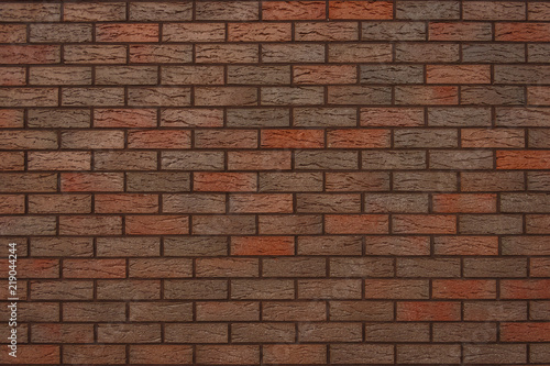 The wall of decorative facing bricks. Close-up 