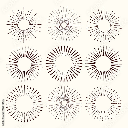 Set and collection of trendy hand drawn retro sunburst/bursting rays design elements.
