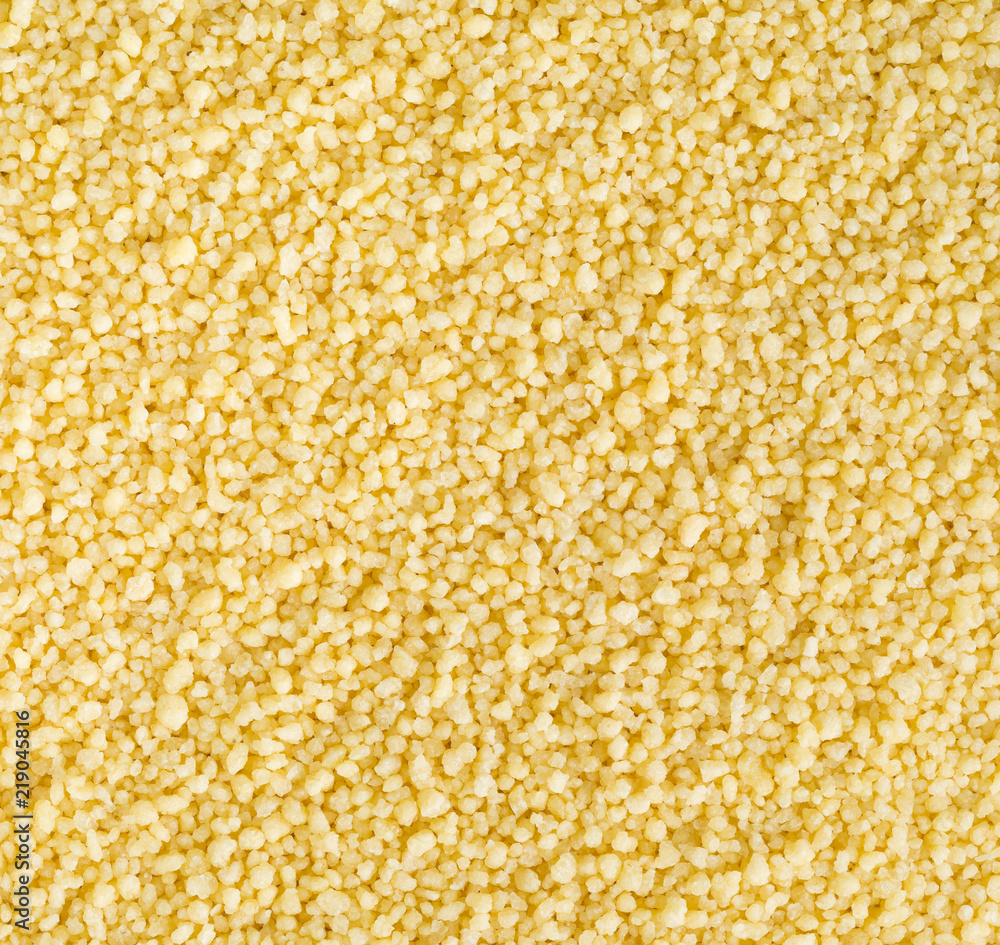 Raw, uncooked couscous background Raw, uncooked couscous background