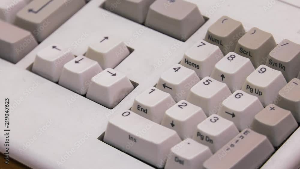White computer keyboard. Computer or game console from the 90s. Old retro style. , Panning, closeup. White computer keyboard. Computer or game console from the 90s. Old retro style. , Panning, closeup.