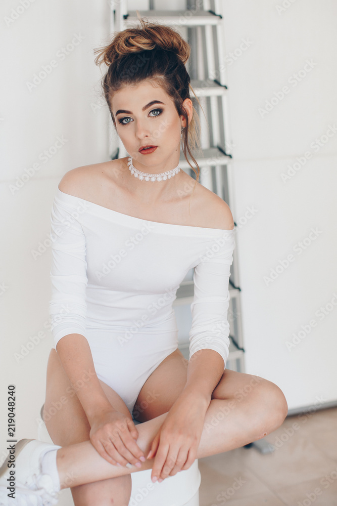 Girl in a fashionable color combination of clothes. Total white. Natural colors. Natural female beauty. Girl in a fashionable color combination of clothes. Total white. Natural colors. Natural female beauty.