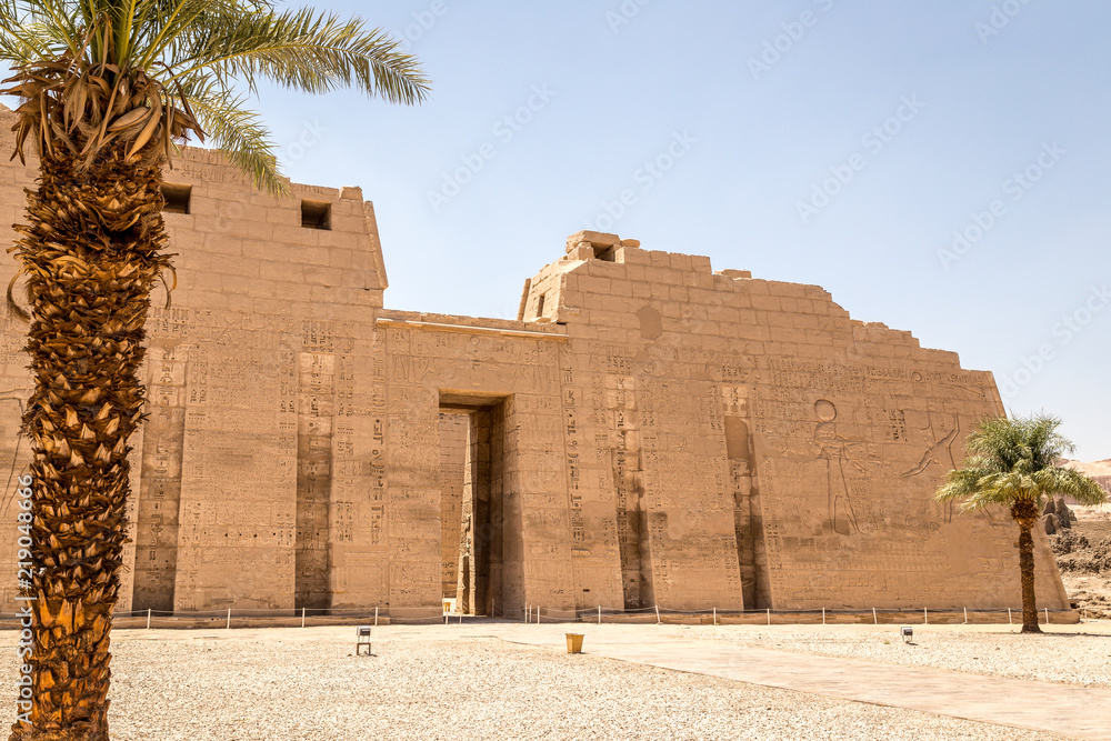 Karnak Temple in Luxor. Walls with carvings of gods and heiroglyphs written in Ancient Egypt language.