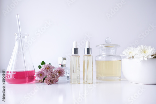 cosmetic skincare beauty product .natural organic flower oil ingredient in the laboratory. packaging spa concept.