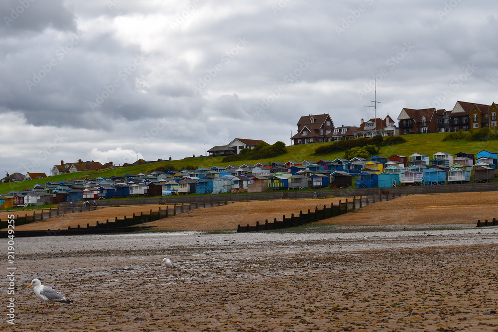 Colourful Whitstable beach huts on the seafront. Whitstable, Kent, UK