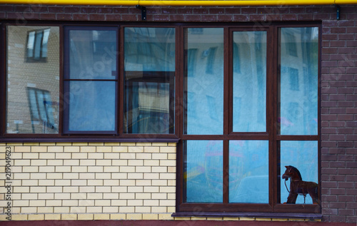 Minimalistic simplicity of scandinavian style building with windows, balconies, boat and bricks, Sweden