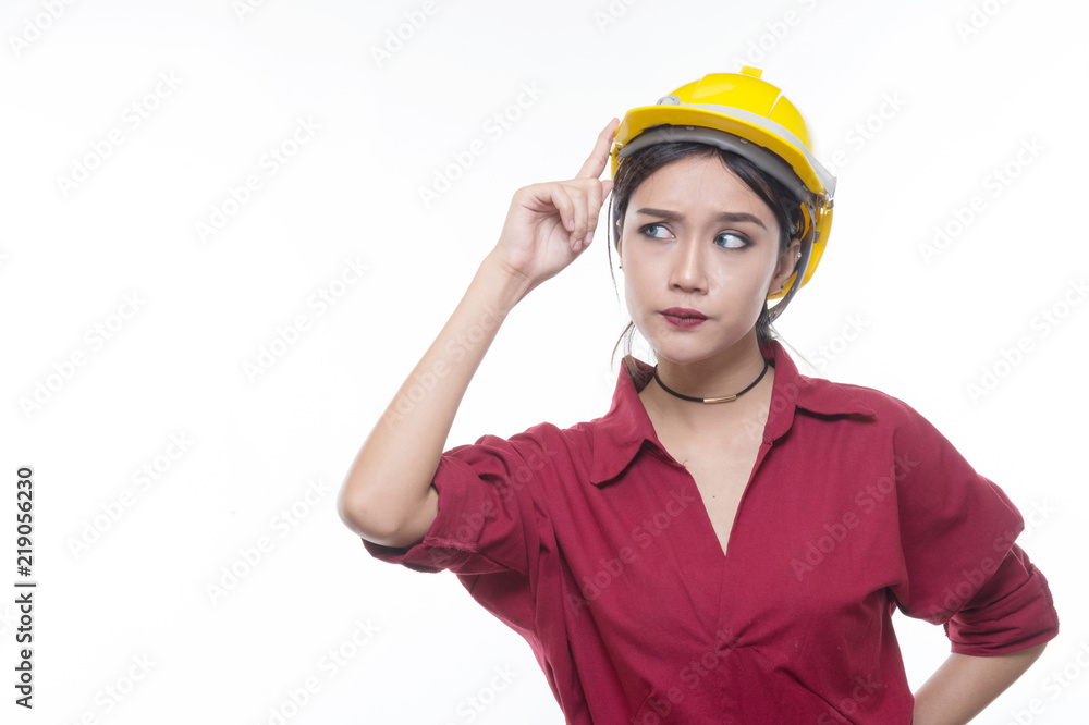 Engineering woman pointing in red shirt with yellow safety helmet in Studio light, occupation concept, Construction preparation, Happy worker Engineering woman pointing in red shirt with yellow safety helmet in Studio light, occupation concept, Construction preparation, Happy worker
