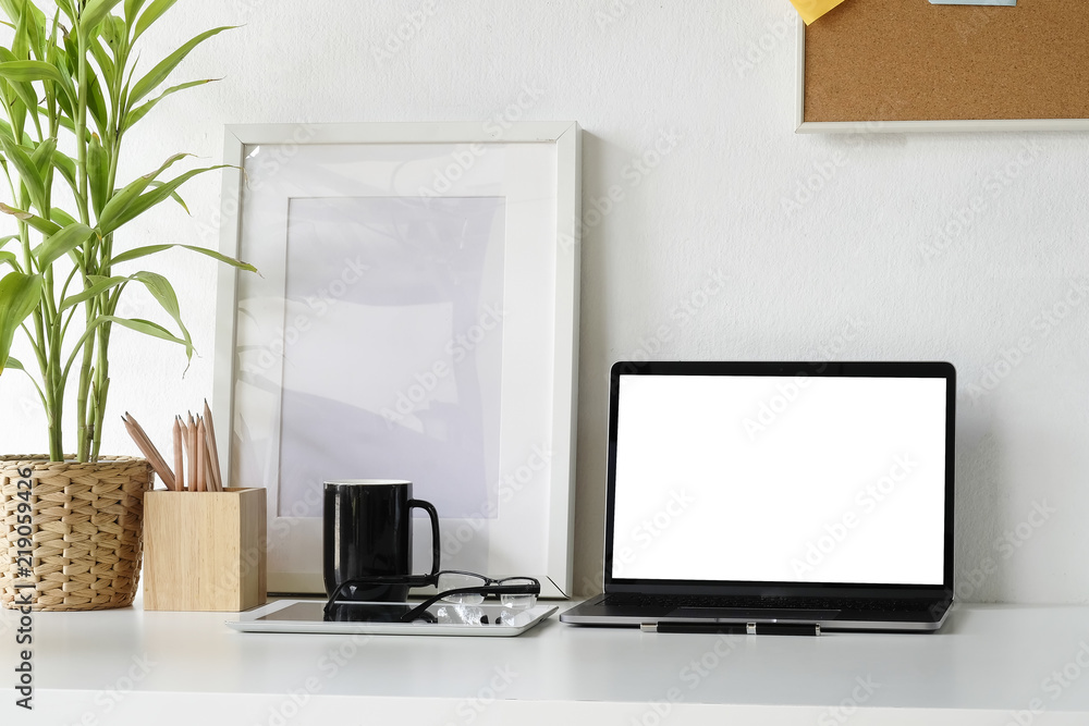 Laptop computer on office table with copy space and object office equipment workspace desk. Laptop computer on office table with copy space and object office equipment workspace desk.