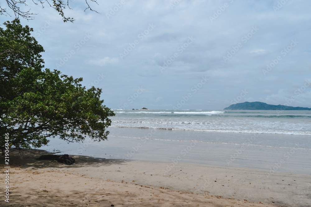 beautiful beach with cloudy sky