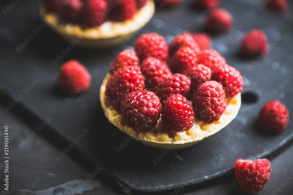 Rasberry cake decorated with fresh ripe berries on the rustic background. Selective focus. Shallow depth of field. Rasberry cake decorated with fresh ripe berries on the rustic background. Selective focus. Shallow depth of field.