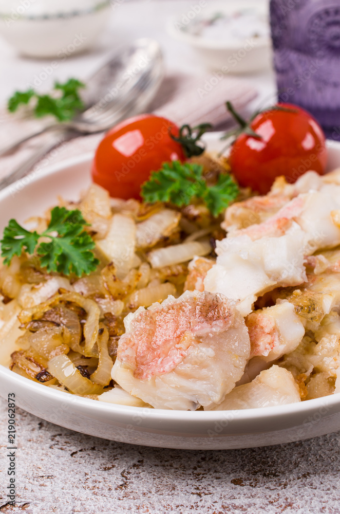 Slices of fried fish with vegetables Slices of fried fish with vegetables