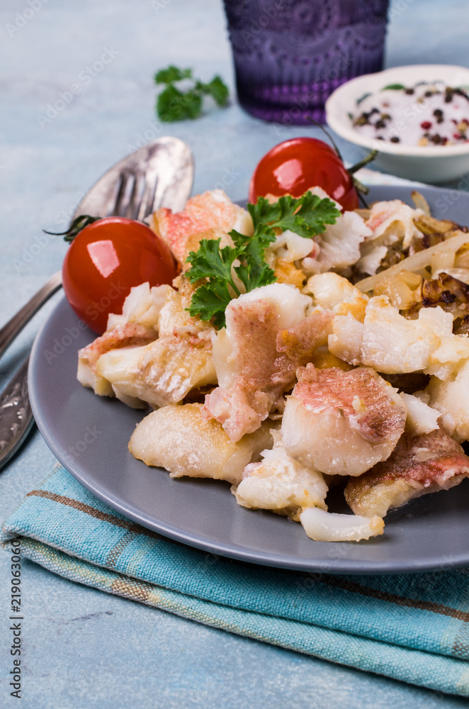 Slices of fried fish with vegetables Slices of fried fish with vegetables
