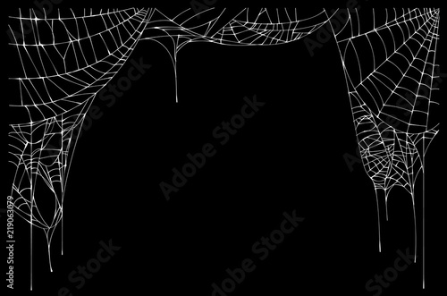 White torn spider web on black background