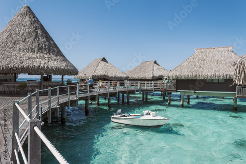 Over water bungalow and a boat in Moorea  French Polynesia