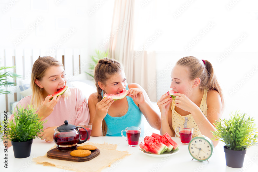 Girls having fun on slumber party eating Girls having fun on slumber party eating