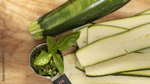Organic fresh cut green garden vegetable zucchini with basil