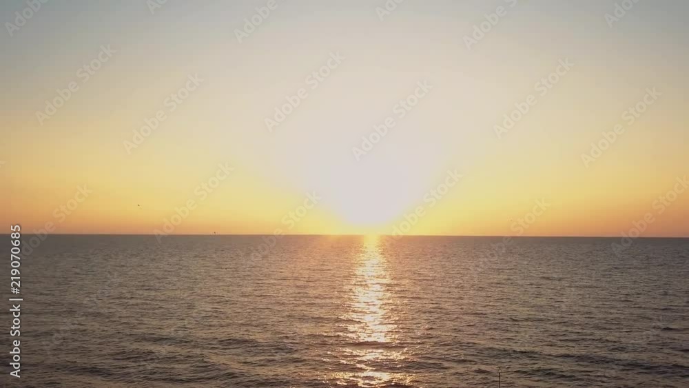 Aerial shot of a sunrise over the ocean Aerial shot of a sunrise over the ocean