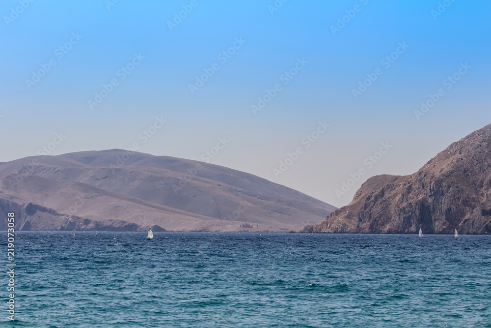 Sea with mountain and small yacht, Baska Croatia