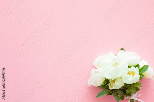 Beautiful, fresh wedding bouquet of white roses on pastel pink table. Soft light color. Greeting card. Mockup for positive ideas. Empty place for inspirational, emotional, sentimental text or quote. © fotoduets