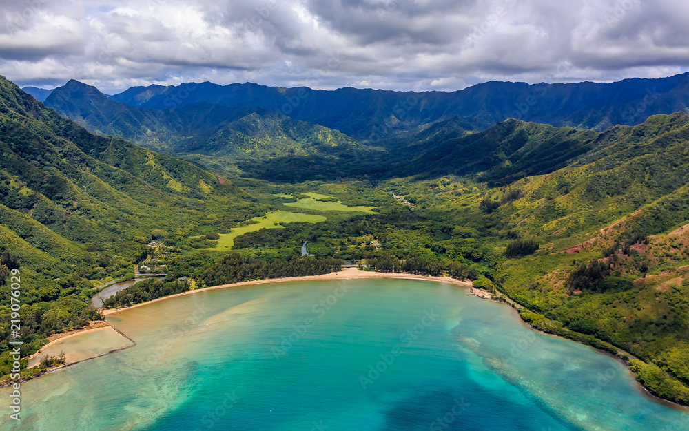 Aerial view Oahu coastline and mountains in Honolulu Hawaii from a helicopter