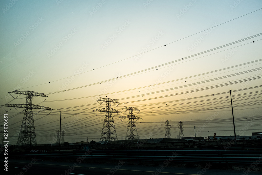 High voltage electric powerlines at dusk