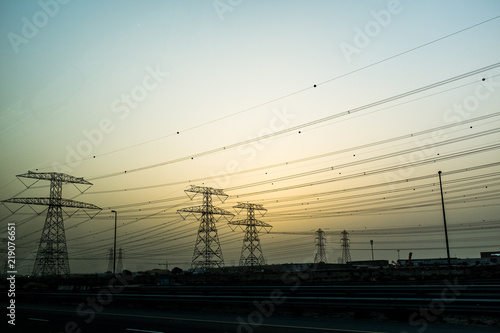 High voltage electric powerlines at dusk