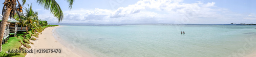 Panorama over Manase Beach  Savai i Island  Samoa  South Pacific - with people in water and traditional beach fale accommodation