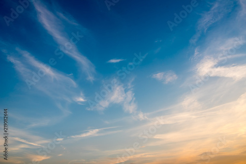 blue sky with slightly colored clouds