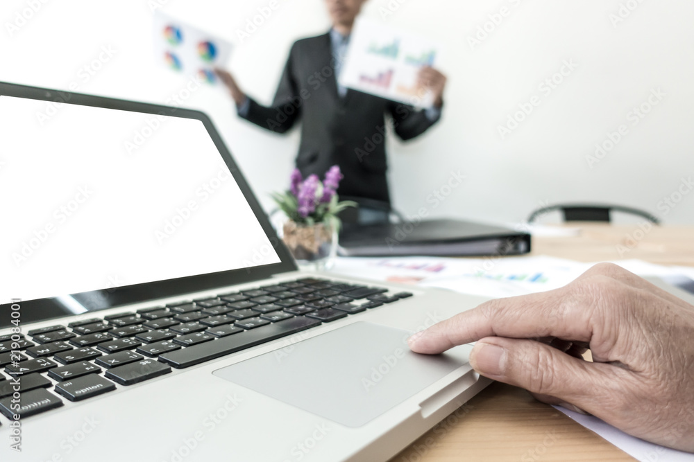 Business man in de-focused reporting his work with reporting paper. Selective focus. Business man in de-focused reporting his work with reporting paper. Selective focus.