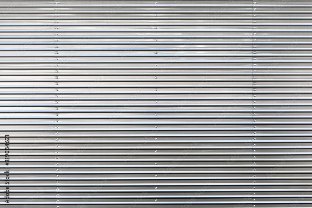 Metal Wall with Structure / Close-up of streamlined clean and shiny grey metallic background (copy space) Metal Wall with Structure / Close-up of streamlined clean and shiny grey metallic background (copy space)