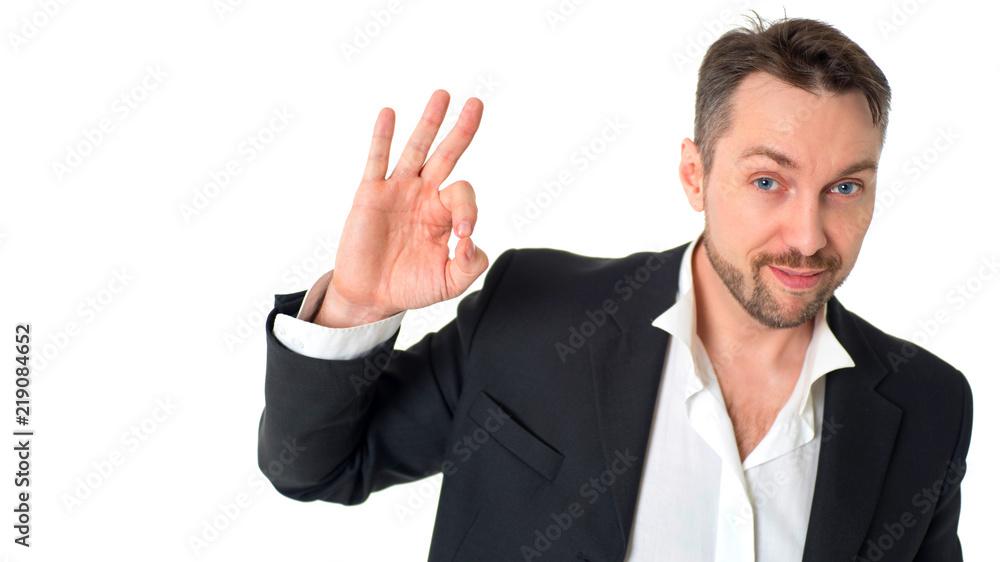Smiling businessman in suit making alright sign. Smiling businessman in suit making alright sign.