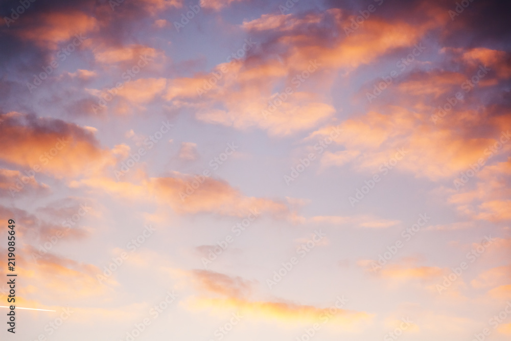 Beautiful bright sunset sky with pink clouds, natural abstract background and texture, heaven, religion