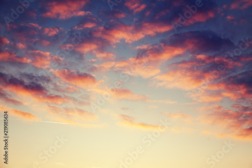 Beautiful bright sunset sky with pink clouds, natural abstract background and texture, heaven, religion