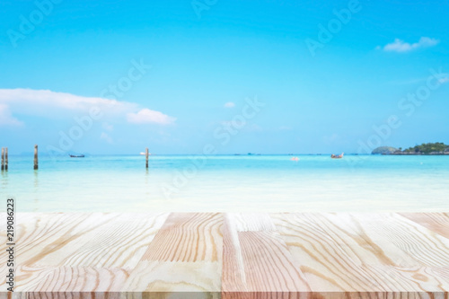 Perspective empty pine wooden table on top over blur background, can be used mock up for montage products display or design layout.