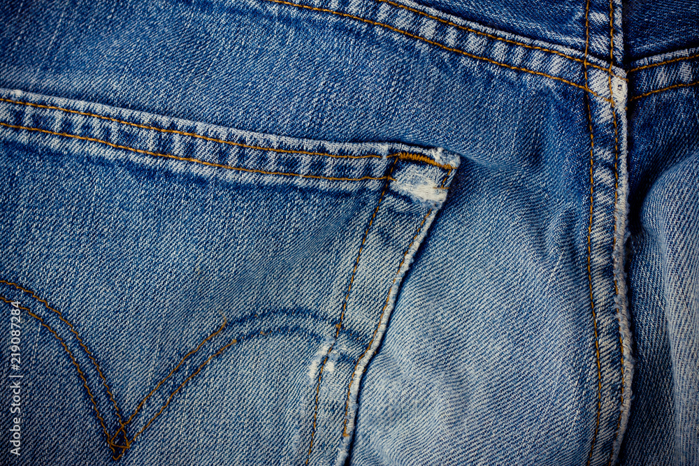 old blue jeans seam detail cloth of denim for pattern and classic background close up
old blue jeans seam detail cloth of denim for pattern and classic background close up