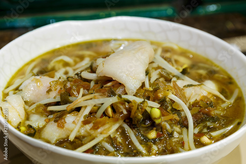 Photography Boiled fish with pickled cabbage with chili