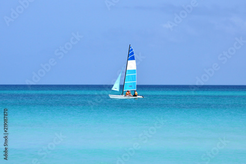 sailing boat in the turquoise ocean