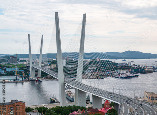 Panoramic view on the Zolotoy Golden Bridge is cable-stayed bridge across the Zolotoy Rog or Golden Horn in Vladivostok, Russia photo