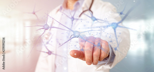 Photos Doctor holding a 3d rendering group of neurons