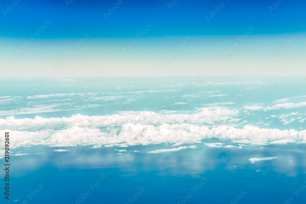 A view of the sky and clouds from the airplane window. Below is the Black Sea water. A view of the sky and clouds from the airplane window. Below is the Black Sea water.