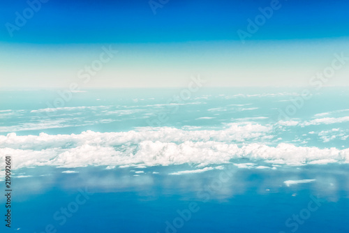 A view of the sky and clouds from the airplane window. Below is the Black Sea water.
