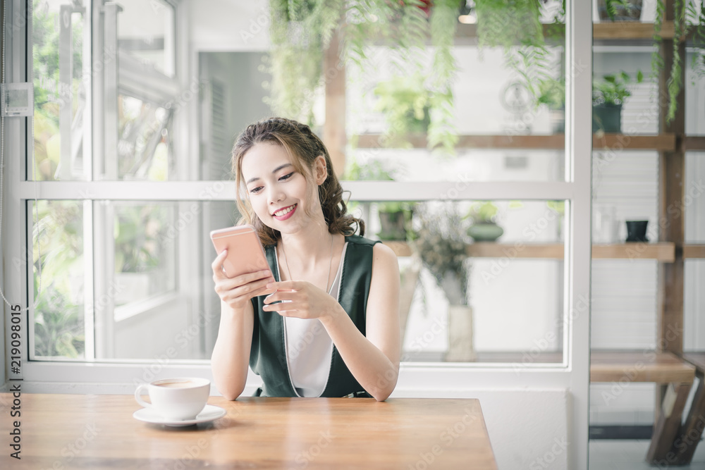 Beautiful Asian girl using her mobile phone
Beautiful Asian girl using her mobile phone