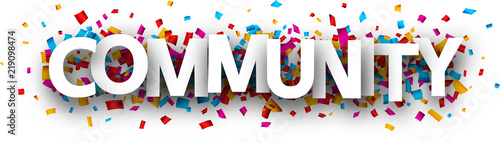 Community sign with colorful confetti.
