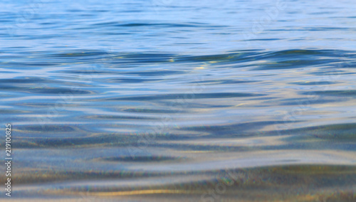 Blue clear water. Sea  lake  sun  beach  vacation Background for inserting images and text. Tourism  travel.