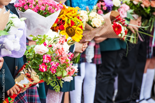 Bouquets of flowers in hands of children