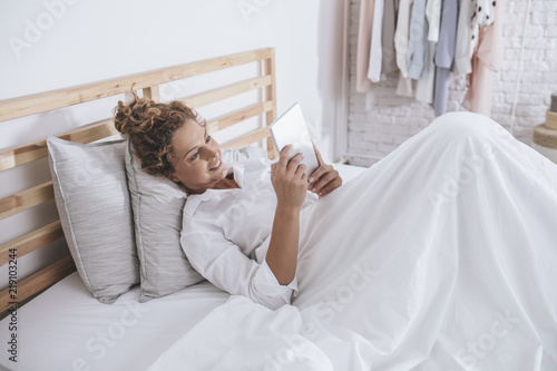 Woman Enjoying Morning in Her Bed