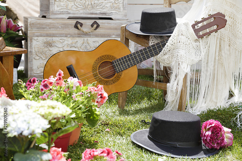 Classic spanish guitar with flamenco elements and flowers photo